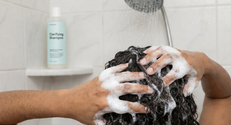 Clarifying shampoo for removing buildup from low porosity hair