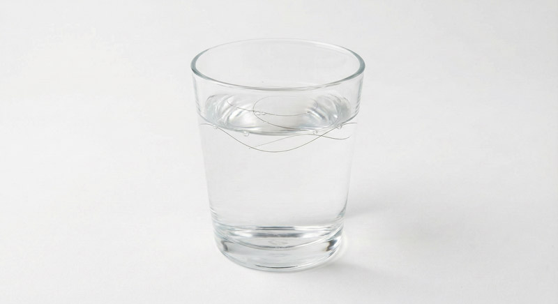 Low porosity hair float test showing hair floating on water